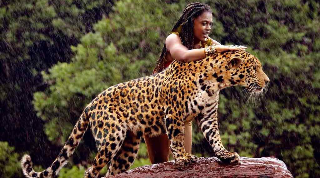 a woman standing on a log with a jaguar - Ai generated